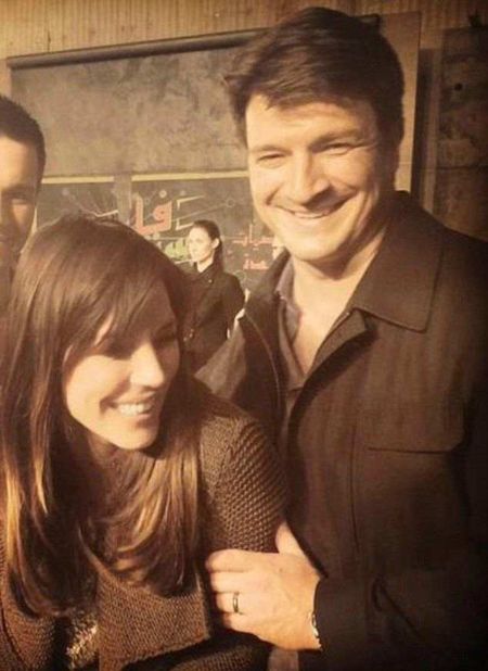 Actor Nathan Fillion poses a picture with Krista Allen.